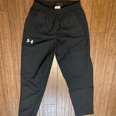 Brand New Under Armour Sweatpants Size Medium, Black Zipper At Bottom Of Legs Never Worn Mens Underarmour Sweatpants, Under Armour Bottoms With Pockets, Casual Under Armour Pants, Under Armour Casual Streetwear Pants, Under Armour Bottoms With Pockets For Streetwear, Under Armour Streetwear Bottoms With Pockets, Black Casual Under Armour Sweatpants, Black Sporty Sweatpants By Under Armour, Sporty Streetwear Bottoms By Under Armour