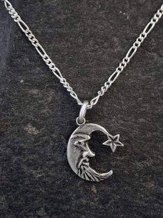 This solid 3 Dimensional Moon and Star pendant is Sterling Silver. The included chain is a Sterling Silver Figaro 50 chain. You may choose 16, 18 or 20 inch at the same price. Other length available at sightly higher prices. This Moon and Star pendant measures 11/16" tall by 9/16" across. I hand cast all my pieces using the lost wax casting method. Please ask your needs. You may call me with questions, often I am out so please use my machine. 831-476-3176. Satisfaction Guaranteed!I send items US Moon Pendant Necklace Silver, Silver Chain Necklace With Moon Charm As Gift, Silver Necklaces With Moon Charm, Star And Moon Necklace Silver, Sterling Silver Moon Shaped Necklace With Star Charm, Sterling Silver Star And Moon Charm Necklaces, Moon And Star Pendant, Moon And Star, Wax Casting