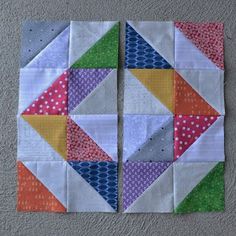 two pieces of colorful quilted fabric sitting on top of each other