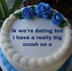 a cake with blue frosting and roses on it that says, if we're dating but i have a really big crush on u