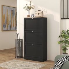 a black filing cabinet sitting in the corner of a room