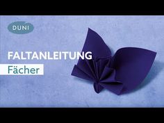 an origami flower on a blue background with the words facher written below it