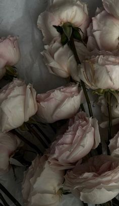 some pink flowers are in a vase on the table