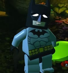 the lego batman movie character is standing in front of a green and yellow background with leaves