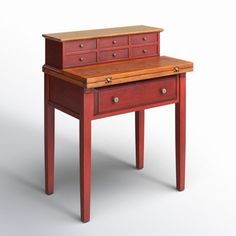 a small wooden desk with drawers on one side and an open drawer on the other