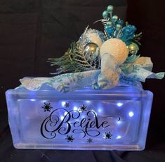 an ice box with ornaments and lights on it