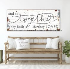 a wooden bench sitting in front of a wall with a sign above it that says, and so together they built a life they loved