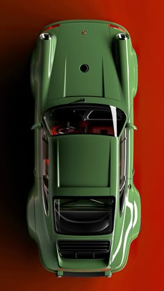 an overhead view of a green sports car on a red and orange background with the hood down