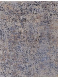 an area rug with blue and beige colors