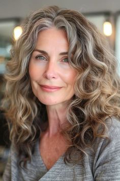 31 Chic Curly Hairstyles For Women Over 50 For A Style Refresh - The Hairstyle Edit Medium Length Wavy Hair, Voluminous Curls, Curly Hair With Bangs, Hairstyles Over 50, Embrace Change, Curly Hair Cuts, Women Over 50, Hairstyles For Women