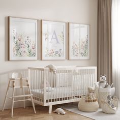 a baby's room with three framed pictures on the wall