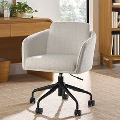 a white office chair sitting on top of a rug