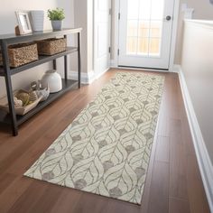 a white and brown rug in front of a door