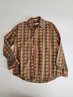 Vintage Norm Thompson Long Sleeve Checkered Pattern Shirt  Size Medium see pics for measurements 60s 70s look / style Made in Korea Muted fall colors - orange brown green Checker Plaid Pattern Cotton poly blend Excellent vintage condition From a smoke and pet free home 60’s Fashion Men, 70s Male Fashion, Muted Fall Colors, 70s Mens Fashion, 60’s Fashion, 70s Men, 70s Look, 70s Shirts, Seventies Fashion