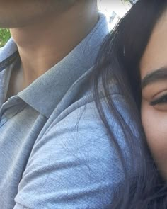 a close up of a person and a woman with long hair smiling at the camera