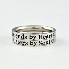 "This listing is for 2 stainless steel band ring, engraved with \"Friends by Heart\" and \" Sisters by Soul\" on the outside. It makes a very cute gift for best friends, forever sisters. Materials & Features: This ring is made of high quality hand polished solid stainless steel, which is hypoallergenic (good for metal-sensitive skin). Stainless steel will not tarnish, its luster and durability will make it last for many years. The black text on the ring will not fade out over time. Sizes: This r Heart Sisters, Bff Rings, Sisters Best Friends, Sister Rings, Matching Sisters, Sisters By Heart, Bff Gift, Friend Bff, Sorority Sisters