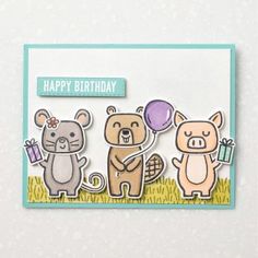 a card with two animals holding balloons and the words happy birthday written in blue on it