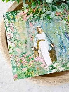 a painting of jesus walking through a garden