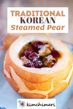 traditional korean steamed pear recipe with cranberries and nuts in a bread bowl on a blue plate