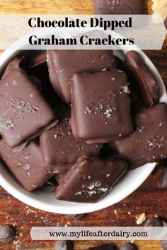 chocolate dipped graham crackers in a white bowl on a wooden table with text overlay