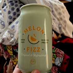 a can of melon fizz is held up