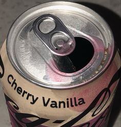 a can of cherry vanilla soda sitting on top of a table