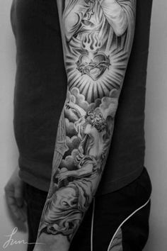 a man's arm with tattoos on it and an image of the virgin mary