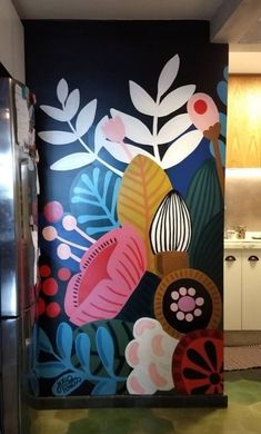 an artisticly painted wall in a kitchen