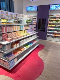 a store display filled with lots of different types of items and colors on the shelves