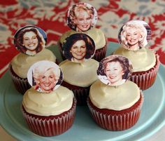 cupcakes with pictures of women on them are sitting on a blue platter