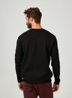 Our crewneck sweater is the perfect addition to your fashion collection. It's soft, stretchy, and breathable fabric makes it that much better. Details Model is 6'1" and wears a size medium. Care: Machine wash cold with similar colors on delicate cycle. Do not bleach. Do not tumble dry. Iron on low. Dry flat. Do not dry clean. Composition: 54.5% Viscose | 45.5% Polyester Black Crew Neck Sweater For Fall, Black Knit Sweatshirt With Ribbed Collar, Black Crew Sweater With Ribbed Neckline, Black Crew Neck Sweater With Ribbed Collar, Black Knit Sweatshirt With Ribbed Cuffs, Black Stretch Sweater With Ribbed Cuffs, Black Knit Sweatshirt For Layering, Black Crew Neck Sweatshirt With Ribbed Neckline, Black Knit Crew Neck Sweatshirt