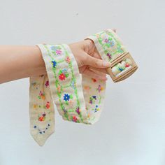 A sweet circa 1960s belt, lovingly handmade from pale cream linen, hand embroidered with multicoloured florals set inside bright green frames. Fastening with carved wooden slider buckle, it would also stylistically suit earlier 30s-40s wardrobes 30" total length, shown on a 25" waist mannequin which fits well 2 2/8" wide Great condition, a little minor marking to reverse side which looks like colour transfer, odd very small foxing dot which isn't noticeable when worn SHIPPING includes tracking a Handmade Belt, Handmade Belts, Green Frame, Suspender Belt, Summer Cotton, Waist Belt, Summer Accessories, Hand Embroidered, Buckle