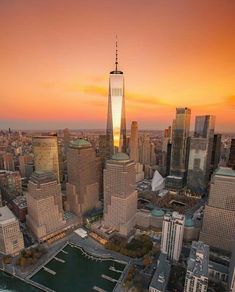 an aerial view of new york city at sunset