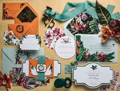 an assortment of wedding stationery items on display