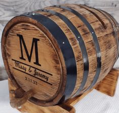 a wooden barrel sitting on top of a table