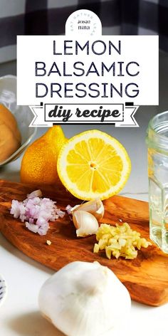 lemon balsamic dressing recipe on a cutting board with garlic, onions and lemons