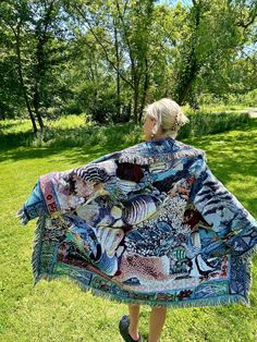 Introducing my latest creation! Upcycled a beautiful woven tapestry blanket into this cozy, one of a kind blanket coat. Features gorgeous underwater ocean life scene. Dreamy, boho wanderlust vibes. Sure to turn heads wherever you may roam. Double front pockets and toggle closure for added functionality. Measurements: Overall length: 40" Pit to pit laying flat: 23" Shoulder seam to wrist: 22" 100% cotton. Machine wash, tumble dry on low heat. This statement jacket was made with all of my heart, for any human, anywhere, that may be attracted to its vibe! My intention is that the piece will amplify the divine nature of your inner being. ✨🌙 Underwater Ocean, Blanket Cardigan, Seashell Print, Tapestry Blanket, Blanket Coat, Divine Nature, Statement Jacket, Woven Tapestry, Woven Blanket