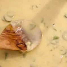 an image of food being cooked in a pan with broth and mushrooms on the side