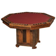 a wooden table with a red cloth on it's top and four leg bases