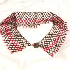 Handwoven Lattice Collar In Iridescent Brown And Vibrant Red Bugles And Is Accented With Fossil Beads. This Pattern Originates With The Women Of Transylvania Two Hundred Years Ago And Was Made Famous By Ruth Bader Ginsberg. This Collar/Necklace Is 20" In Length. Bugle Bead Patterns, Ruth Bader Ginsberg, Red Beaded Chain Costume Jewelry, Elegant Red Beaded Bib Necklace, Red Beaded Chain Costume Necklace, Red Beaded Bib Necklace, Brown Large Beads Costume Necklace, Antique Buttons, Bugle Beads