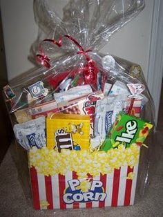 a popcorn box filled with candy and candies