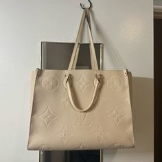 Authentic Louis Vuitton Crme Monogram Empreinte Onthego. It Is Used And Has Flaws That I Have Included Images Of. More Than Happy To Send Additional Photos / Details. Feel Free To Send Offers :) Louis Vuitton Bags, Authentic Louis Vuitton, Womens Tote Bags, Louis Vuitton Bag, Louis Vuitton, Monogram, Feel Free, Cream, Color