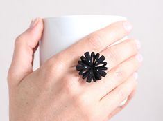 For sure you make a statement with this large floral design ring. This elegant black blossom is an eye-catcher. It would be the perfect match for a witch outfit at the next Halloween pary. Although it's a big ring the comfortable formed ring band makes it pleasant to wear. Not just for Halloween, the ring is a perfect accessory for a day to day outfit or the bloom to an elegant evening dress. The ring is 3d printed in nylon. To receive the highest of quality, I design the 3D templates and send t