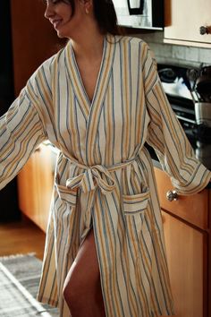 Relax at home wearing this beautiful robe featuring soft yellow stripes. We use it right out of the shower: It's the lightweight fast-drying robe you always wanted. It's cozy to wear at home every day, while some of our customers can pull off wearing it as a summer trench coat. Our robes have usable pockets, a hanging loop, and a generous belt. Sleeves are made short so they don't get in the way. Made out of our Turkish towel material, they always smell fresh, even in the most humid environments Bathrobes For Women, Summer Trench Coat, Smell Fresh, Soft Yellow, How To Make Shorts, Pull Off, Yellow Stripes, Turkish Towels, Hand Loom