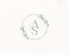 the letter s is inscribed in a circle with leaves