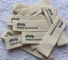 several labels are laid out on a white towel to show the names of medical accessories