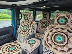 the interior of a vehicle with crocheted seats