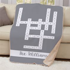 a gray and white blanket with the words'the williams'on it