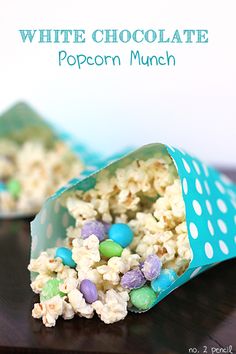 white chocolate popcorn munch with m & m candies in the wrapper on top