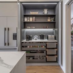 a kitchen with lots of drawers and cabinets